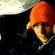 A man in an orange hat in grainy video footage